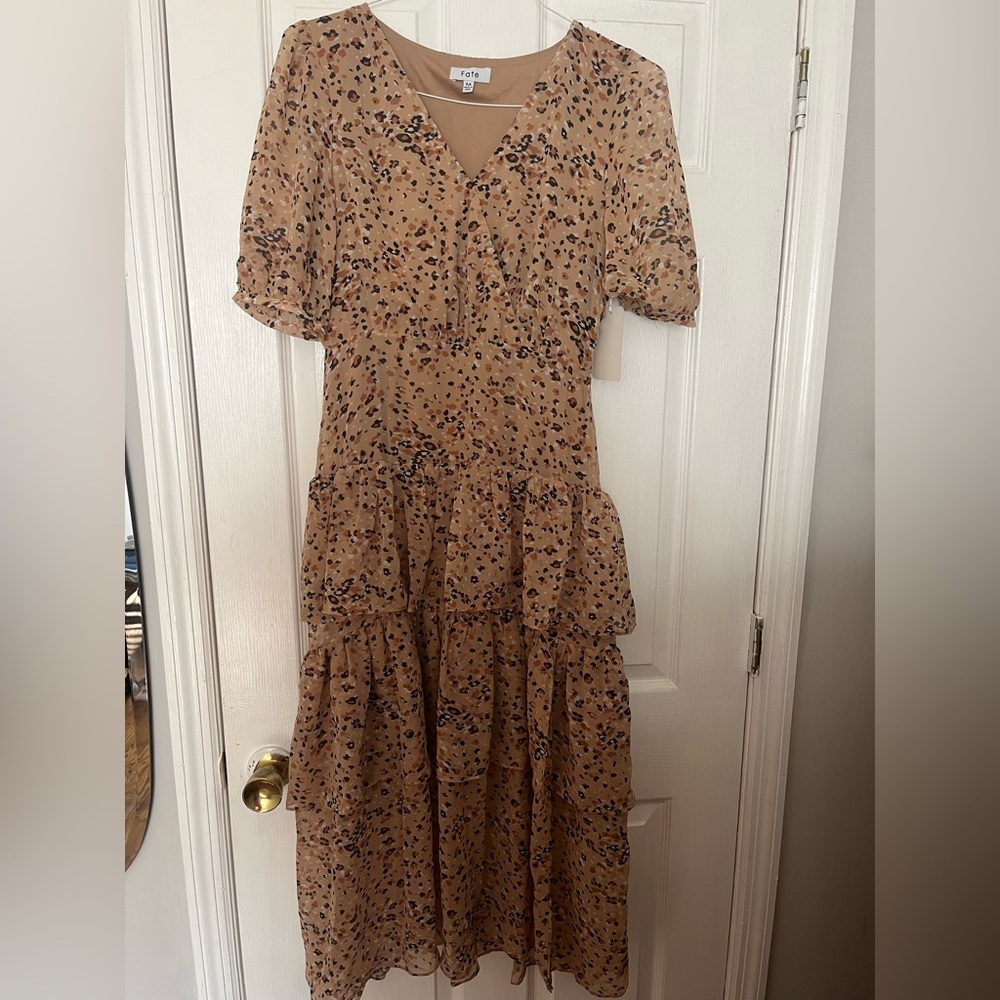 Gorgeous brand new dress with tags size M (fits a small too)